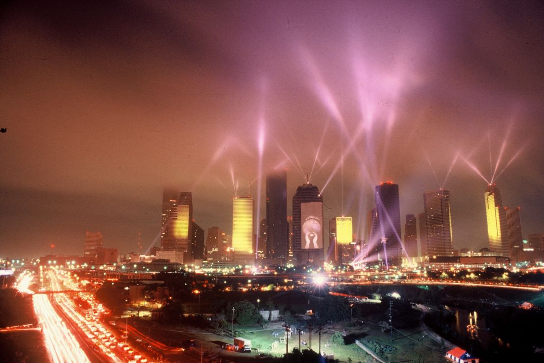 Spotlights illuminate the Houston skyline during Jean-Michel Jarre's April 1986 concert.