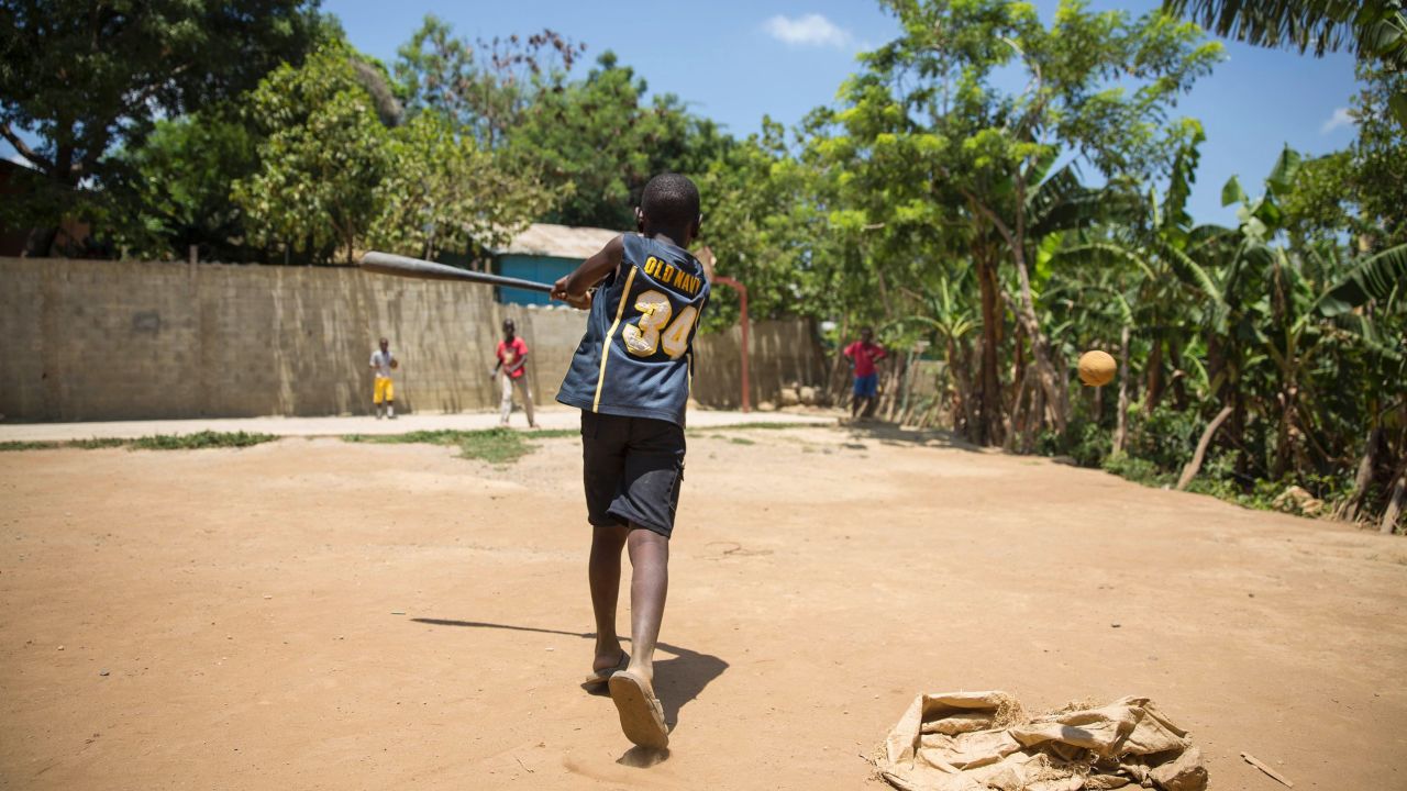 Outside, the Esperanza schoolyard was still alive with children shouting, running and kicking up dirt as they stomped around a rectangular dirt lot where they played baseball and other games.  