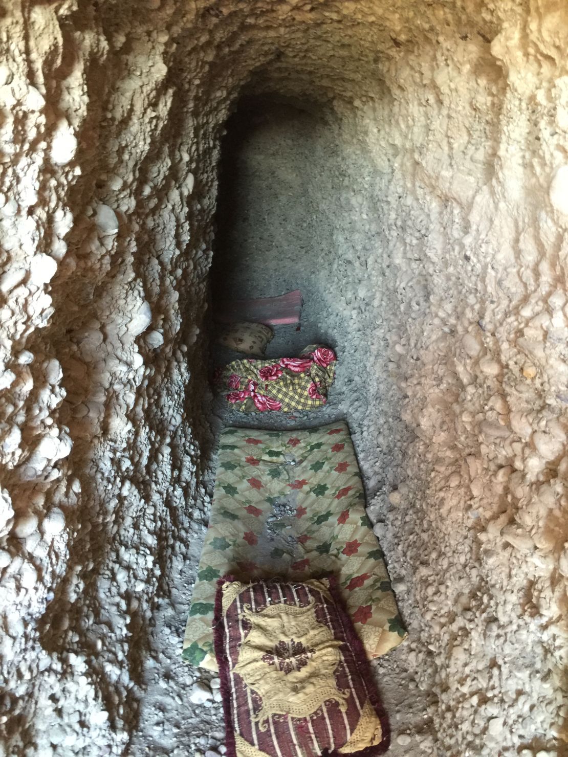ISIS militants dug tunnels beneath a hill in Kharbardan in which to shelter from coalition airstrikes.