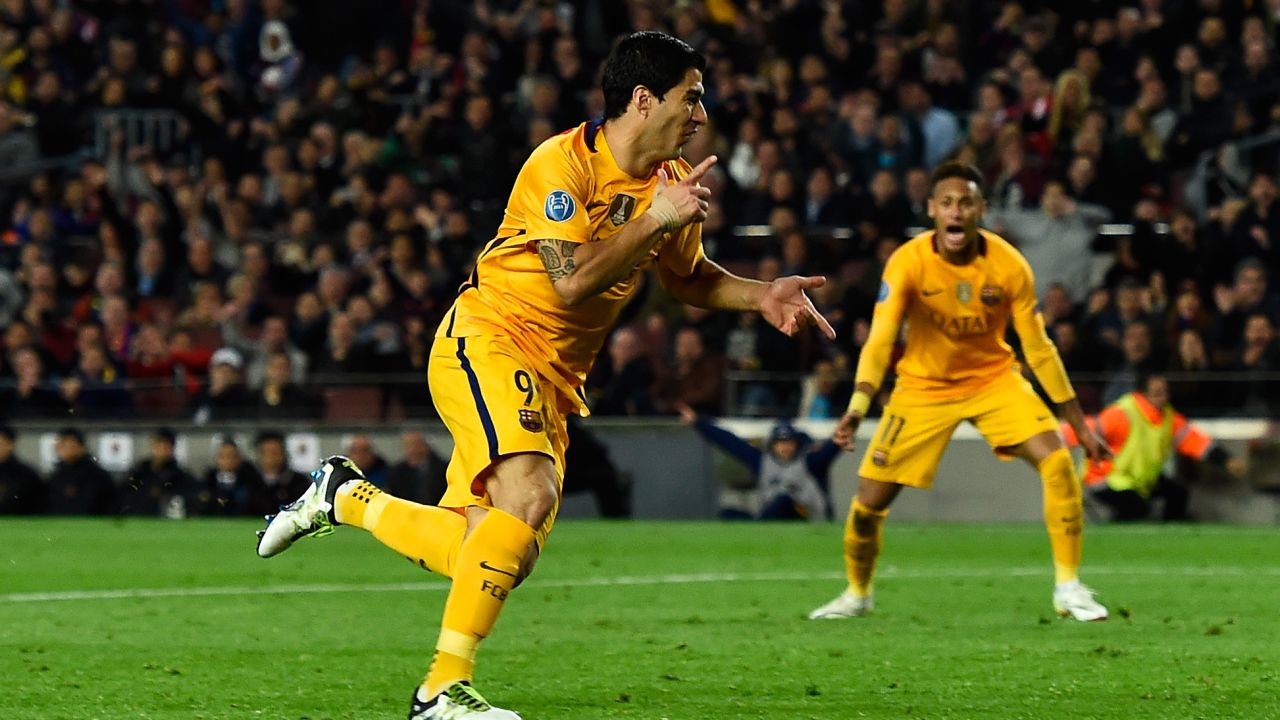 Luis Suarez celebrates after scoring the decisive second goal for Barcelona in the Nou Camp. 