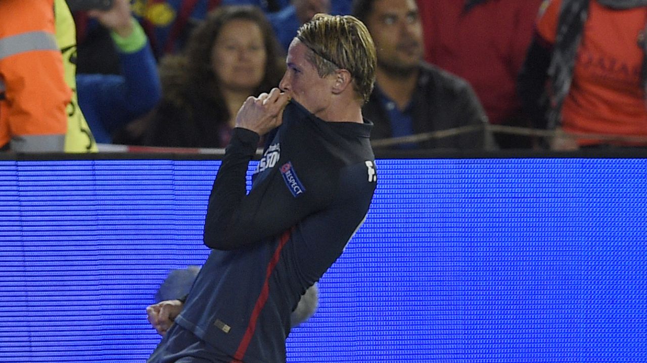 Torres celebrates after opening the scoring but his joy soon turned to agony in the Nou Camp.