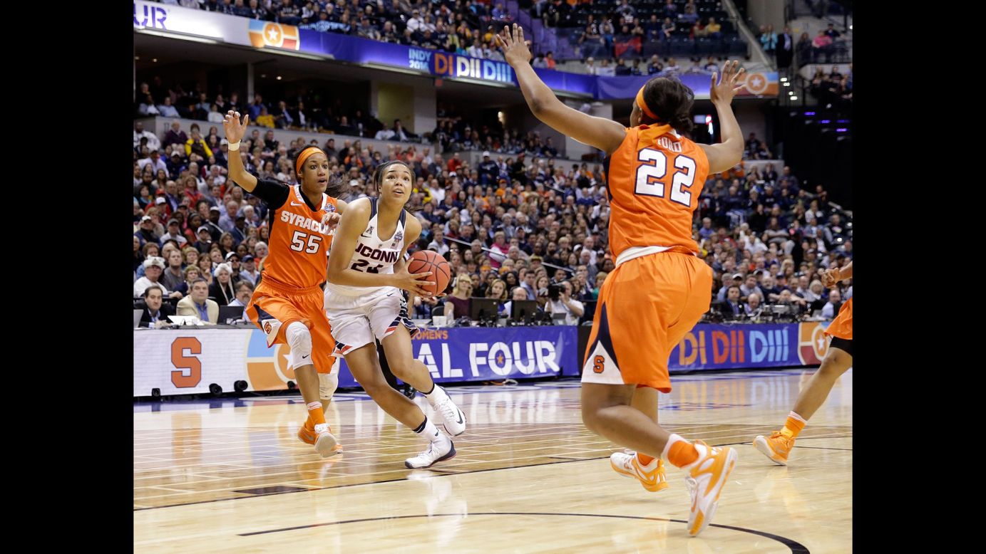 Connecticut's Napheesa Collier goes to the basket against Syracuse's Bria Day, left, and Taylor Ford.