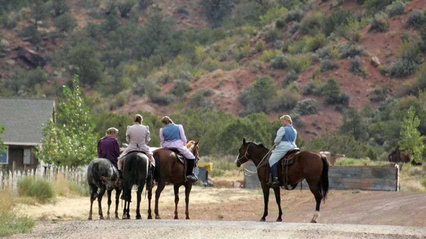 COLORADO CITY, AZ - SEPTEMBER 6:  Women sit on horses September 6, 2006 in Colorado City, Arizona. Warren Jeffs, of the Fundamentalist Church of Jesus Christ of Latter Day Saints, is the leader of the polygamist Mormon sect living in Colorado City and  Hildale, Utah. Jeffs, who will face sex charges involving an underage girl in an arranged marriage with an older man, will have his first court hearing September 6 in St. George, Utah.  (Photo by George Frey/Getty Images)