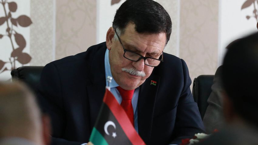 Libya's Prime Minister-designate Fayez Sarraj meets with local mayors inside the naval base in the Libyan capital Sunday.