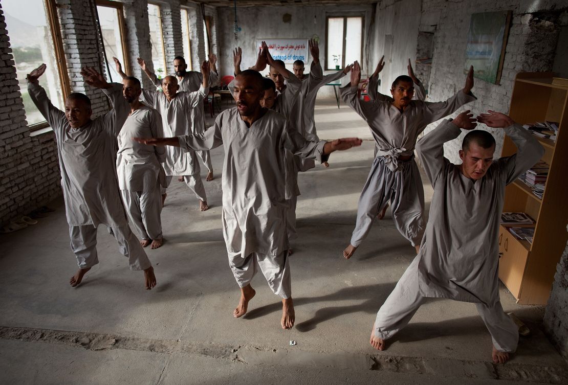 Drug addicts exercise at a rehab center in Kabul. 