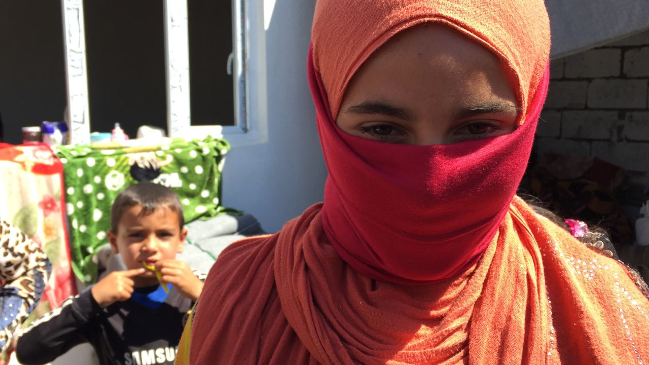 ISIS fighters threatened  Abu Israa's daughter when they spotted her in the back yard without her niqab
