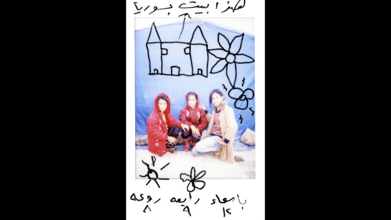 There are drawings on this Polaroid of Asmaa, 12; Rabea, 9; and Raoah, 8. "This is our house in Syria," it says on top.