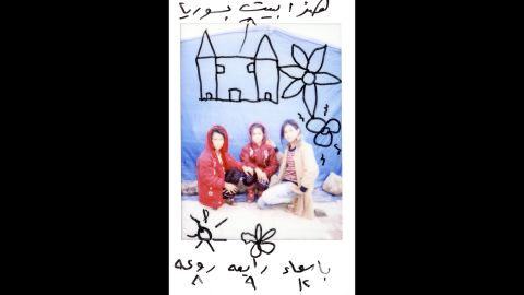 There are drawings on this Polaroid of Asmaa, 12; Rabea, 9; and Raoah, 8. "This is our house in Syria," it says on top.