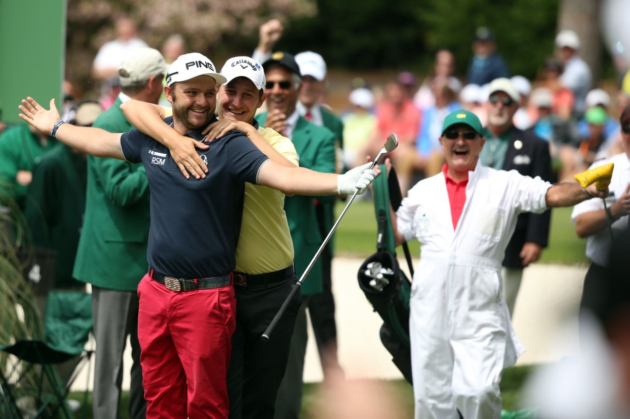 Englishman Andy Sullivan gets a warm Argentinian embrace from Emiliano Grillo after hitting a hole-in-one on the fourth hole.