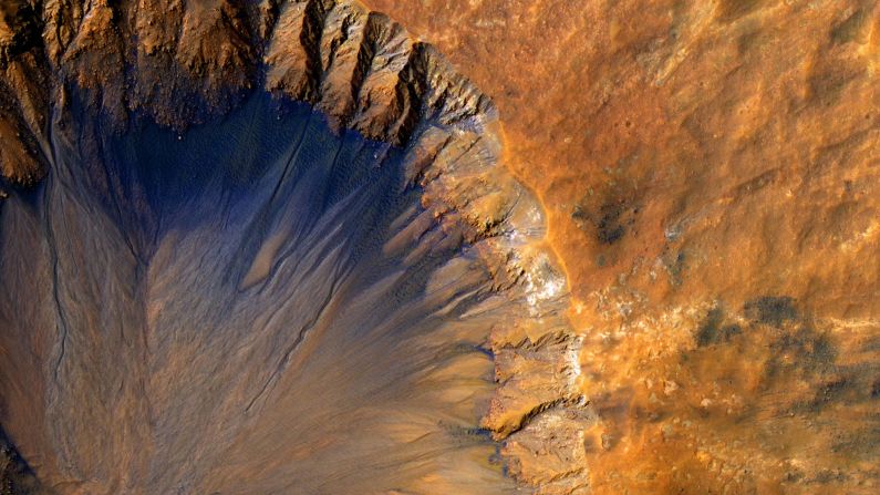 A crater on Mars, estimated to be about 1 kilometer wide.
