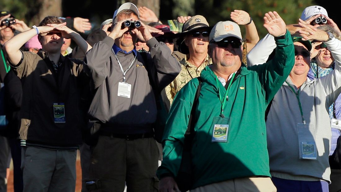 Spectators watch the ceremonial tee shots that were taken Thursday by legends Jack Nicklaus and Gary Player.