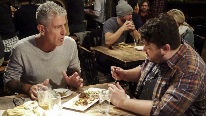Anthony Bourdain and comedian Paul Jurewicz discuss Chicago's Second City over confit beef tripe at Longman & Eagle.