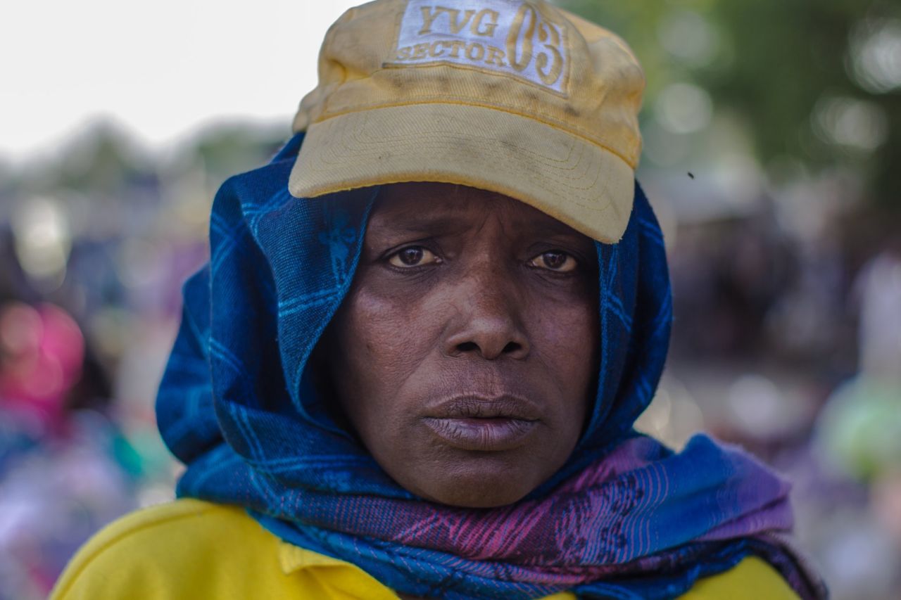 "I come to the market at 6am and sit at my spot. I leave at 6pm. I check all of the women coming into Monday Market. We have to be strict. We have to ensure everyone passes by security checks. I'm dedicated to doing my job."