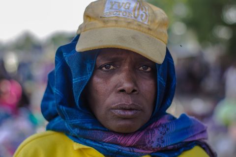 "I come to the market at 6am and sit at my spot. I leave at 6pm. I check all of the women coming into Monday Market. We have to be strict. We have to ensure everyone passes by security checks. I'm dedicated to doing my job."