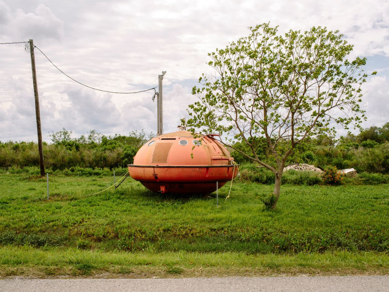 An evacuation pod from an oil rig sits in an empty lot on Island Road. 