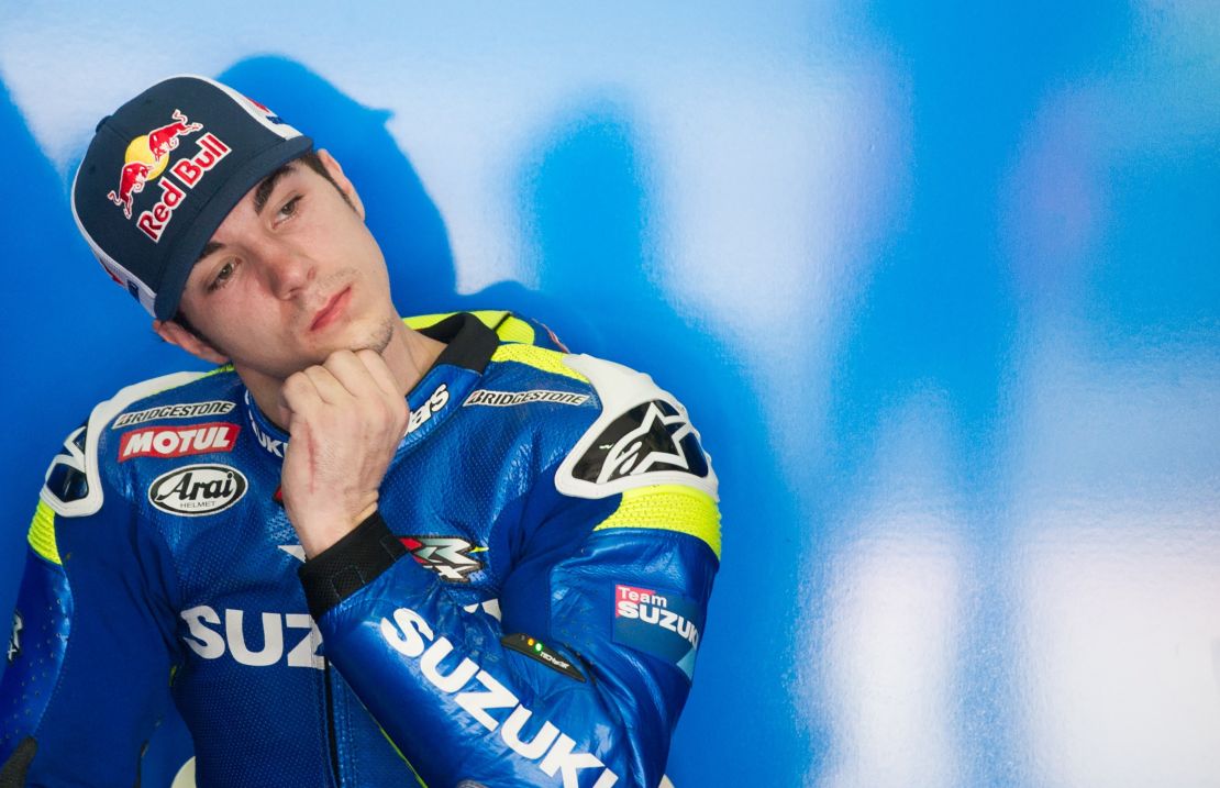 Team Suzuki rider Maverick Vinales of Spain gestures inside his team garage during MotoGP winter testing.