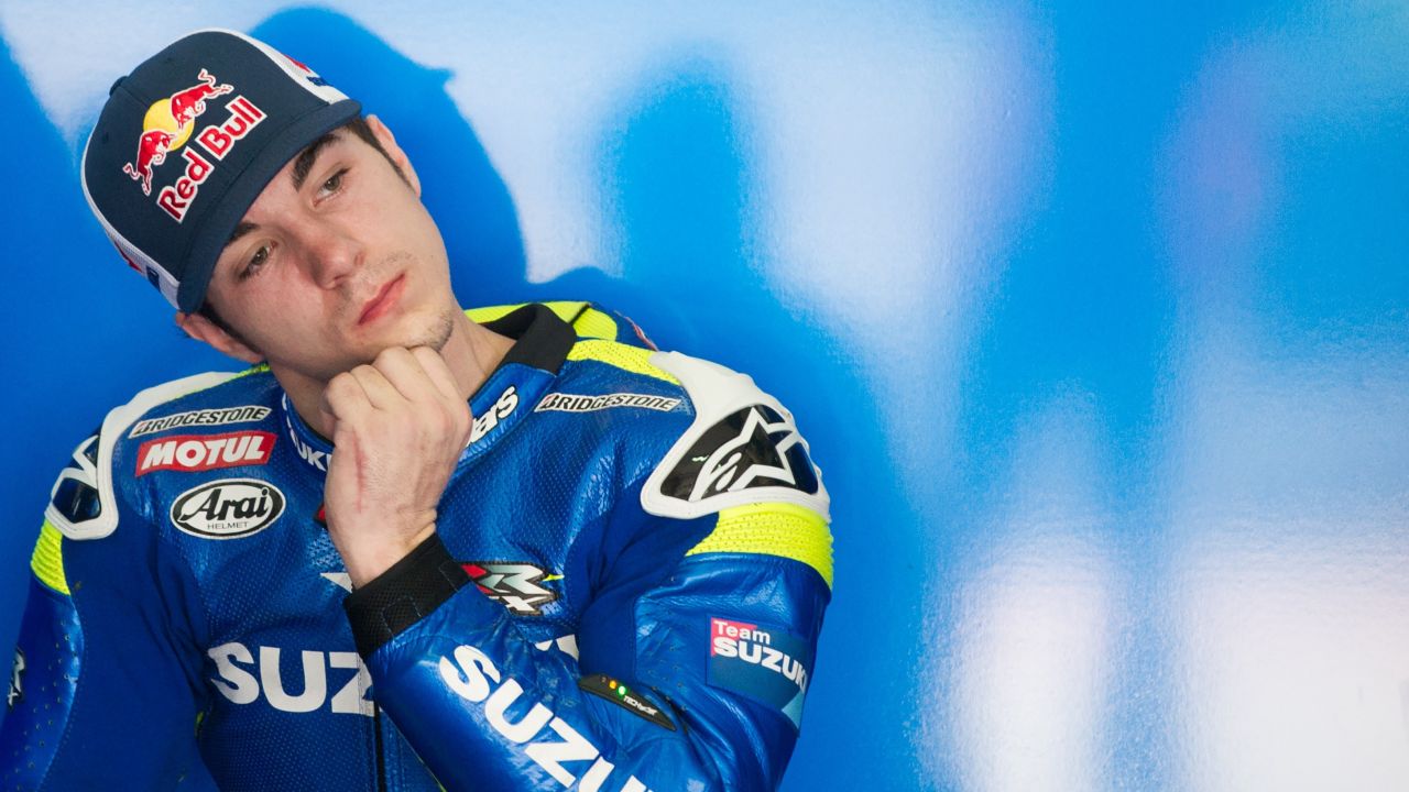 Team Suzuki rider Maverick Vinales of Spain gestures inside his team garage during MotoGP winter testing.