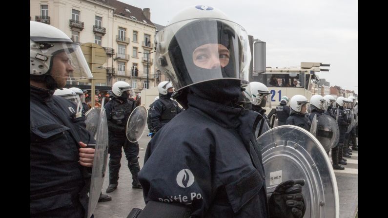 Riot police secure a zone in the Molenbeek neighborhood of Brussels, Belgium, on Saturday, April 2. Belgian police officers and soldiers have fanned out across Brussels, arresting protesters who try to break a ban on demonstrations.