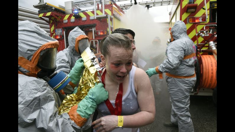 Firefighters wearing chemical-protective clothing attend to "victims" during a mock chemical attack in Saint-Etienne, France, on Monday, April 4. The training exercise was part of security measures for Euro 2016, an international soccer tournament France is hosting this summer. 