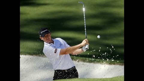 Jimmy Walker plays a sand shot on the 10th.