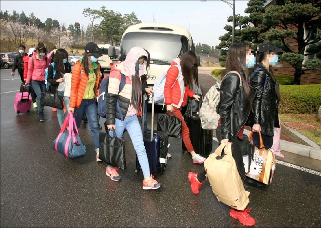 A handout photo from South Korea's Unification Ministry handout photo shows the defectors walking at an unknown location.