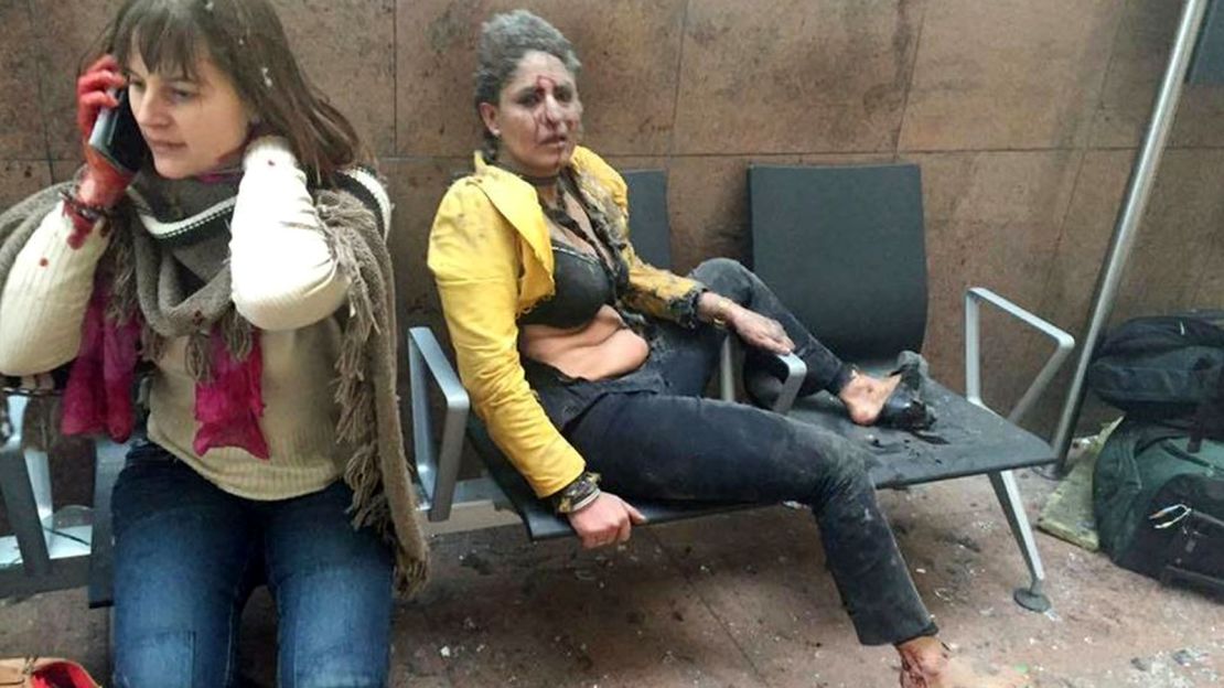 Two women sit at the Brussels airport in Zaventem following the twin explosions on March 22.