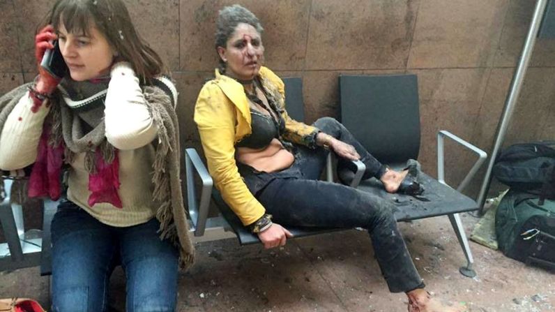 Two wounded women sit in the airport in Brussels, Belgium, after two explosions rocked the facility on March 22, 2016. A subway station in the city <a href="index.php?page=&url=http%3A%2F%2Fwww.cnn.com%2F2016%2F03%2F24%2Feurope%2Fbrussels-investigation%2Findex.html" target="_blank">was also targeted in terrorist attacks</a> that killed at least 30 people and injured hundreds more. Investigators say the suspects belonged to the same ISIS network that was behind the Paris terror attacks in November.