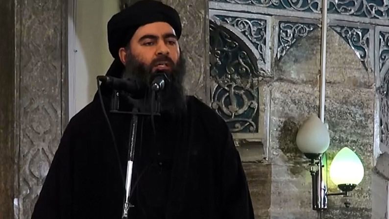 The ISIS militant group -- led by Abu Bakr al-Baghdadi, pictured -- began as a splinter group of al Qaeda. <a href="index.php?page=&url=http%3A%2F%2Fwww.cnn.com%2F2014%2F06%2F29%2Fworld%2Fmeast%2Firaq-developments-roundup%2F" target="_blank">Its aim is to create an Islamic state,</a> or caliphate, across Iraq and Syria. It is implementing Sharia law, rooted in eighth-century Islam, to establish a society that mirrors the region's ancient past. It is known for killing dozens of people at a time and carrying out public executions.