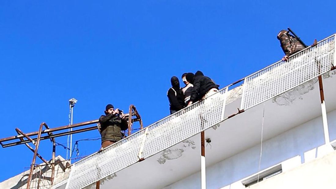 In March 2015, ISIS released video and images of a man being thrown off a rooftop in Raqqa, Syria. In the last photograph, the man is seen face down, surrounded by a small crowd of men carrying weapons and rocks. The caption reads "stoned to death." The victim was brutally killed <a href="http://www.cnn.com/2015/03/05/middleeast/isis-lgbt-persecution/index.html" target="_blank">because he was accused of being gay.</a>