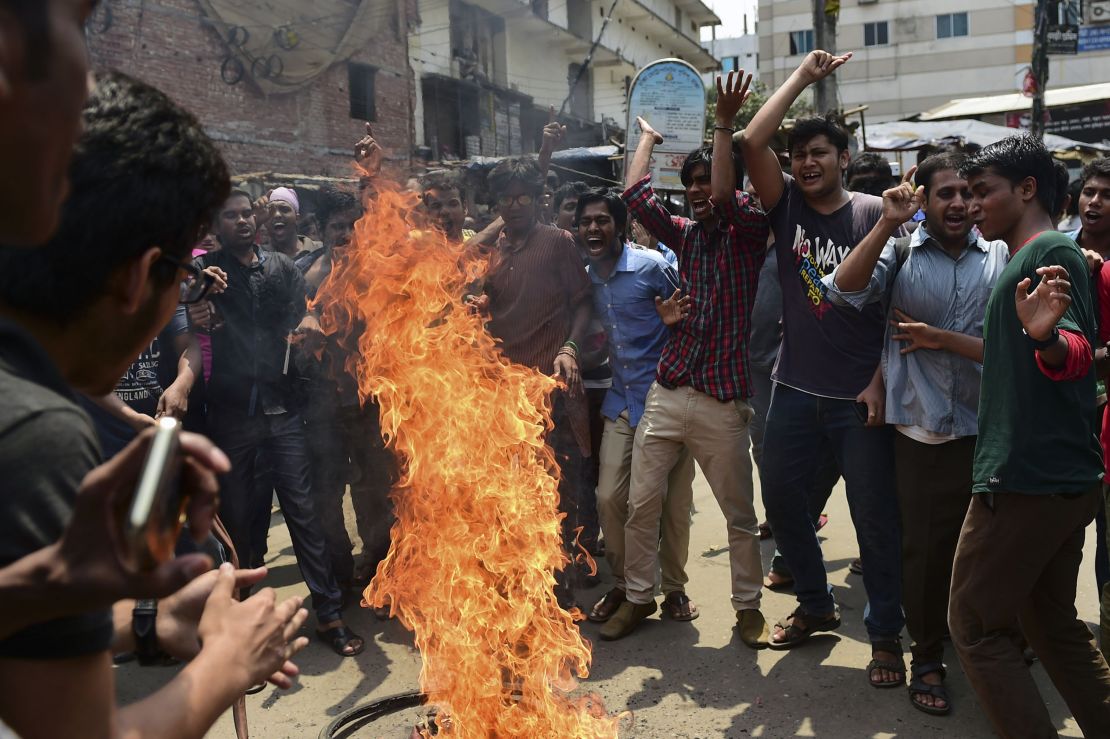 Bangladeshi students block the road and stage a protest  in Dhaka April 7, following Samad's murder.