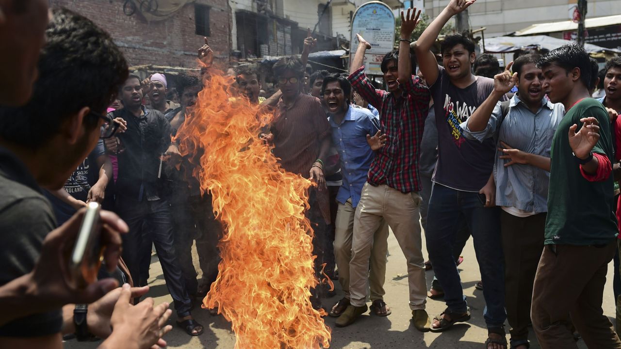 Bangladeshi students block the road and stage a protest in Dhaka April 7, following Samad's murder.