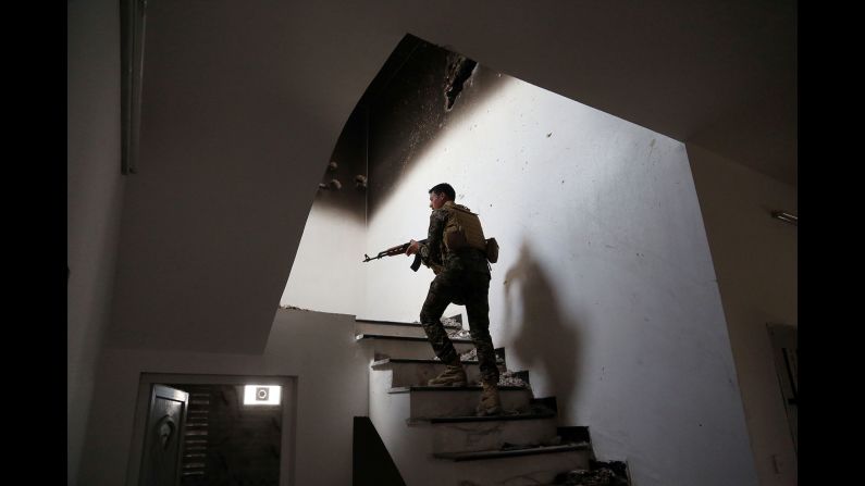 An Iraqi soldier searches for ISIS fighters in Tikrit on March 30, 2015. Iraqi forces <a href="index.php?page=&url=http%3A%2F%2Fwww.cnn.com%2F2015%2F03%2F31%2Fmiddleeast%2Firaq-isis-tikrit%2Findex.html" target="_blank">retook the city</a> after it had been in ISIS control since June 2014.