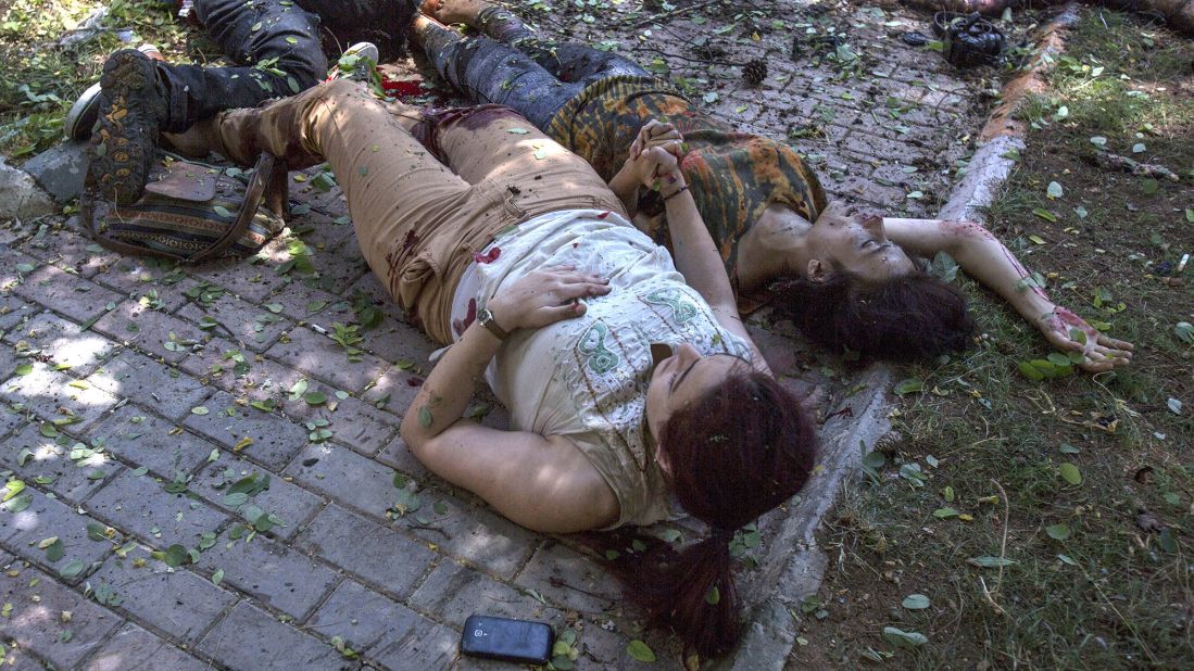 Two women hold hands after an explosion in Suruc, Turkey, on July 20, 2015. The blast <a href="http://www.cnn.com/2015/07/22/world/turkey-suruc-explosion/index.html" target="_blank">occurred at the Amara Cultural Park,</a> where a group was calling for help to rebuild the Syrian city of Kobani, CNN Turk reported. At least 32 people were killed and at least 100 were wounded in the bombing. Turkish authorities said they believed ISIS was involved in the explosion.