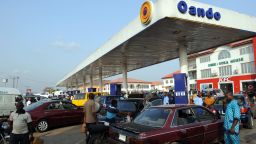 People queue to buy fuel at a filling station in Lagos on March 9, 2016 after unions shut down operations.