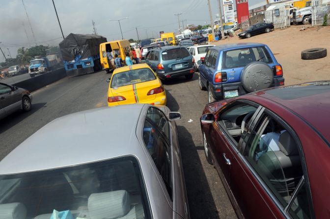 Nigerians rely on gas to fuel generators, as well as for their cars. Pictured, motorists line up to buy fuel in Lagos, on March 9, 2016 after unions shut down operations. 