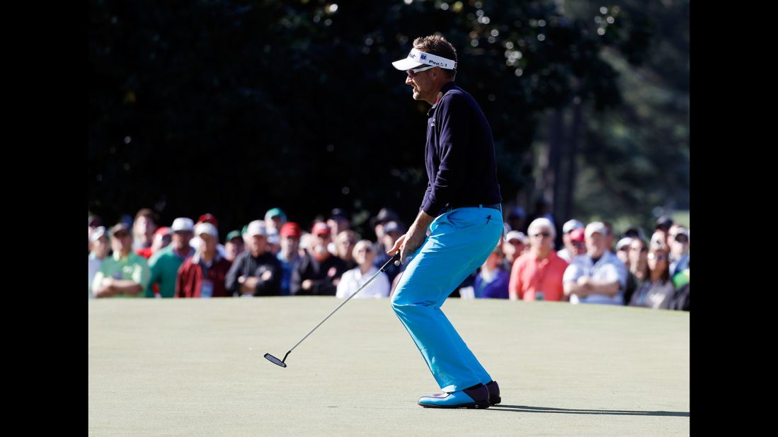 Ian Poulter reacts after missing a putt on the first hole on Friday.