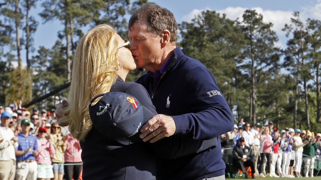 Tom Watson kisses his wife, Hilary, after playing the last round of his Masters career on Friday. Watson, 66, said he will no longer play in the annual event, which he won in 1977 and 1981.