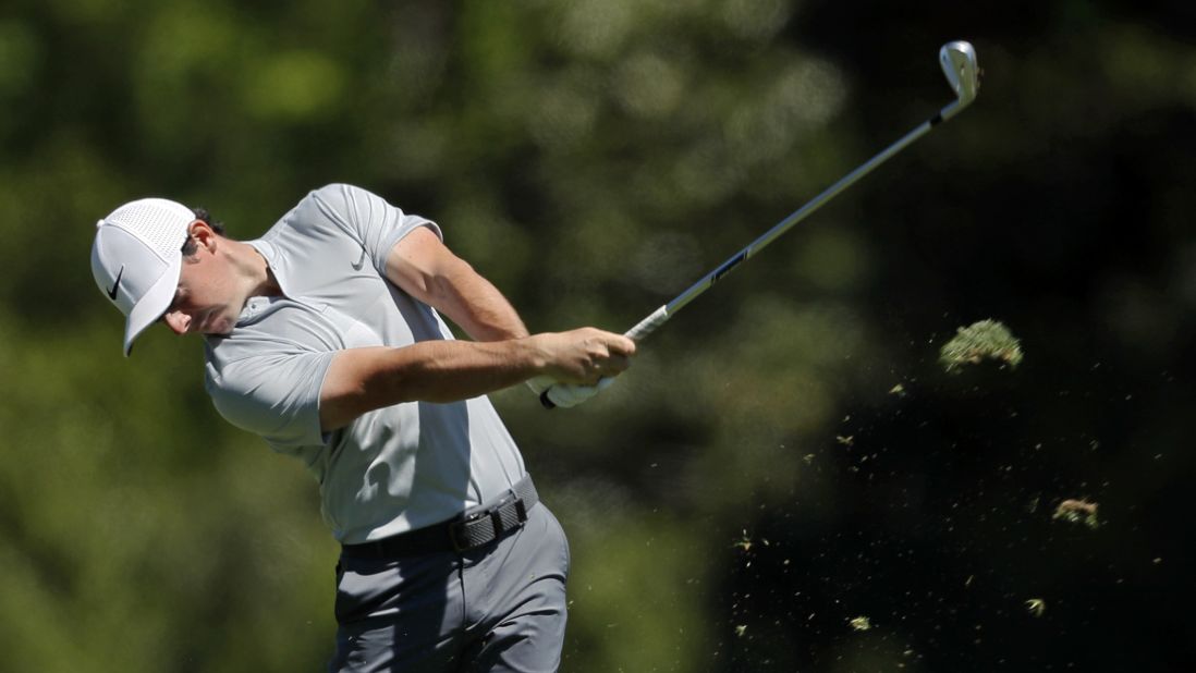 McIlroy hits a shot on the fifth hole Friday. McIlroy was one of only four players who shot under par in the second round. He finished the day 3-under for the tournament, a stroke behind Spieth.