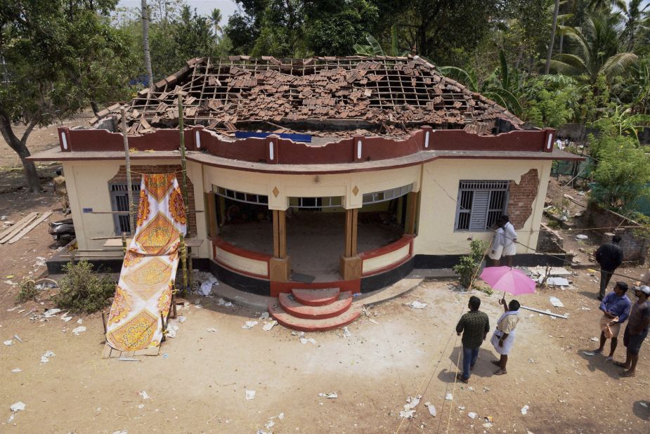 Extensive damage is visible on a building in the Puttingal temple complex.
