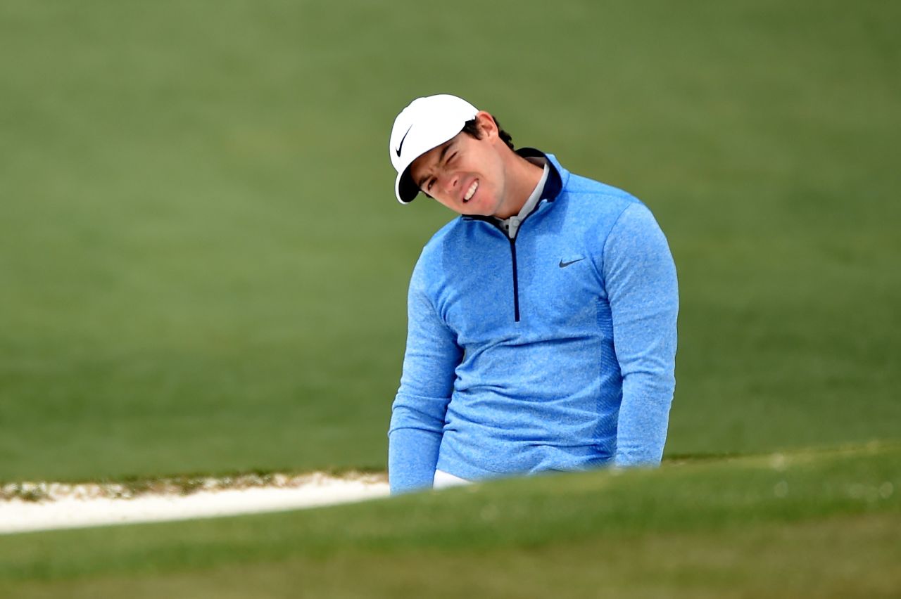 Rory McIlroy reacts to a bunker shot on the second hole Sunday.