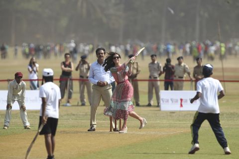 The duchess plays cricket with cricket legend Sachin Tendulkar at the Oval Maidan sporting ground in Mumbai on April 10. 