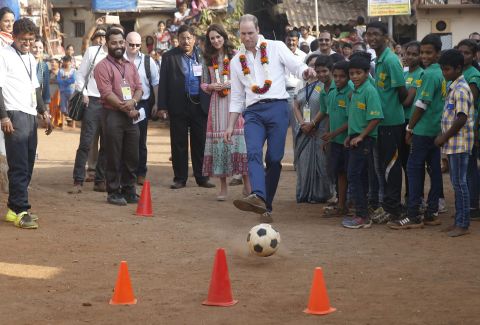 Prince William plays soccer during a visit to a Mumbai slum on April 10.