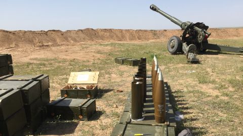 Iraqi military howitzers firing at ISIS' supply lines on the other side of the al-Nasir village.