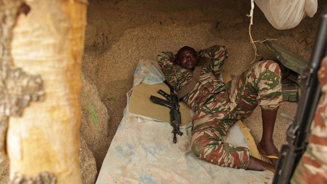 A Cameroonian soldier escapes the mid-day heat at border outpost.