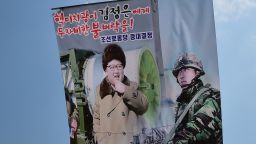 South Korean activists launch large balloons containing anti-Pyongyang leaflets into the air at a field near the Demilitarized zone dividing the two Koreas in Paju on March 26, 2016.