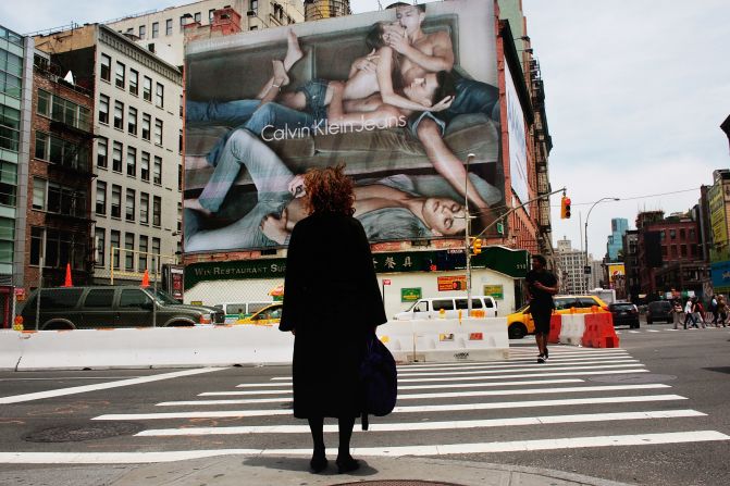 A Calvin Klein billboard in the SoHo neighborhood of New York City in 2009. The provocative ad featuring a topless model and three young men has provoked controversy in the city.