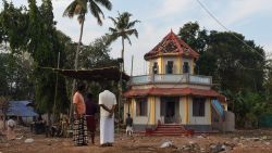 Indian bystanders gather in front of a damaged building at The Puttingal Devi Temple in Paravur some 60kms north-west of Thiruvananthapuram on April 11, 2016. 
More than 100 people have died and 350 injured when fireworks meant to be lit for festivities caught fire and exploded near the temple where thousands of people had gathered to witness the festivities on the early hours of April 10.