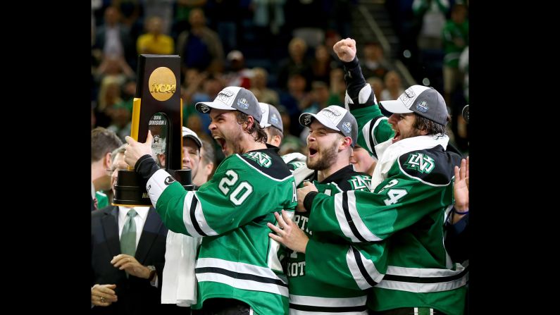 North Dakota's hockey team celebrates after winning the NCAA championship on Saturday, April 9. It's the eighth national title for the Fighting Hawks, who defeated Quinnipiac 5-1 in the final.