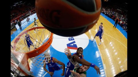 Panathinaikos' Miroslav Raduljica, bottom, competes against Bryant Dunston, a player from Anadolu Efes, during a Euroleague game in Istanbul on Thursday, April 7.