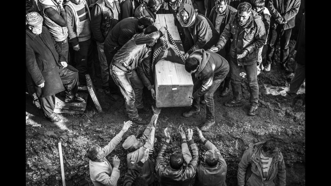 People bury a victim in Sirnak in January.